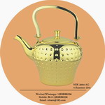 gold tea pot with hammer dots all
